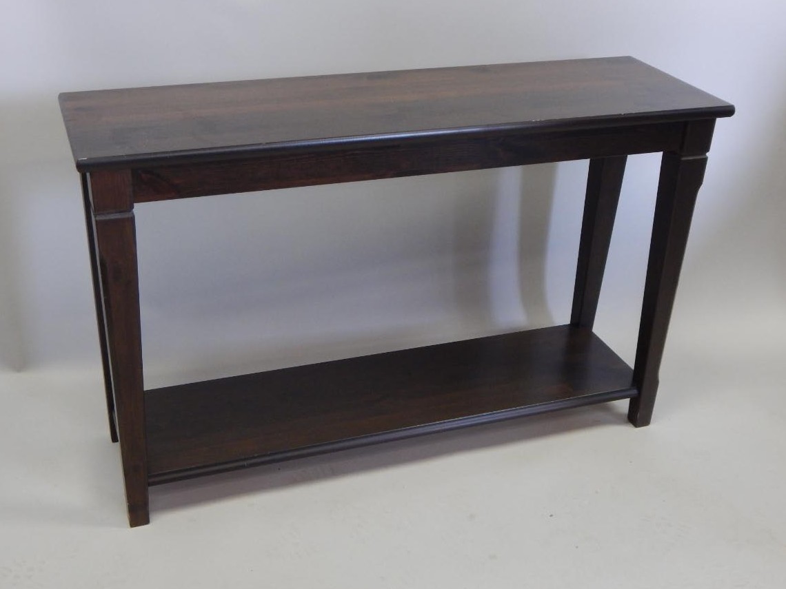 Appraisal: A modern stained pine side table the rectangular top on