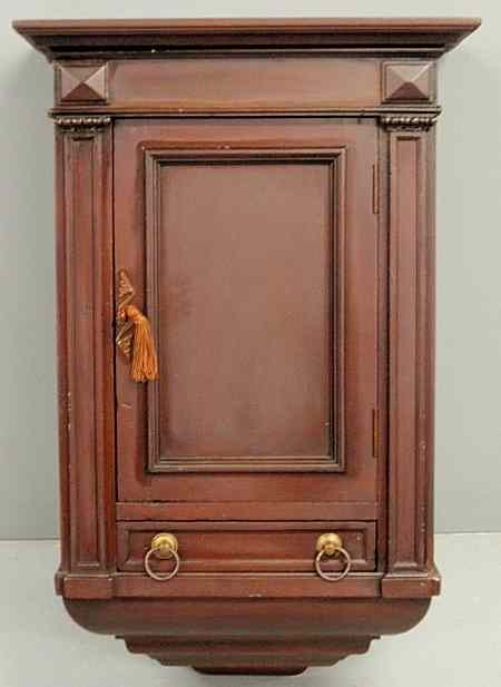 Appraisal: Empire mahogany hanging cabinet th c with left top opening