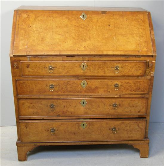 Appraisal: th century walnut crossbanded and herringbone strung bureau the interior