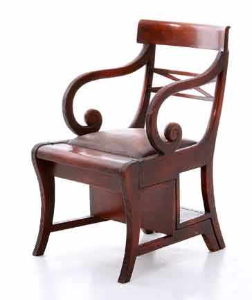 Appraisal: Regency style mahogany metamorphic library chair late th century shaped