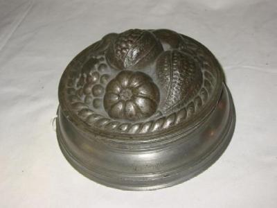 Appraisal: A VICTORIAN PEWTER JELLY MOULD of circular form the domed