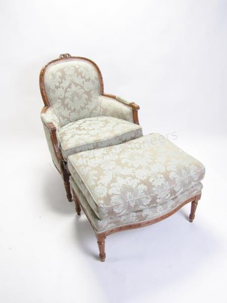 Appraisal: A vintage French period-style bergere and ottoman with carved frame