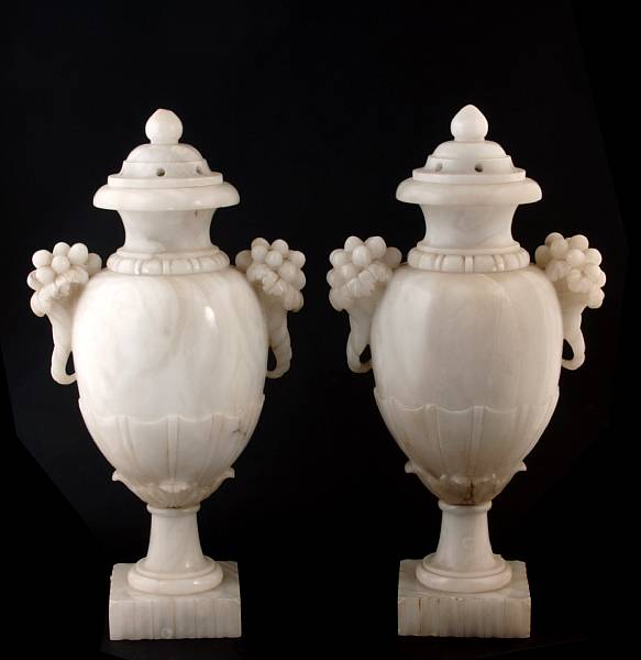 Appraisal: A pair of carved alabaster potpourri urns height in