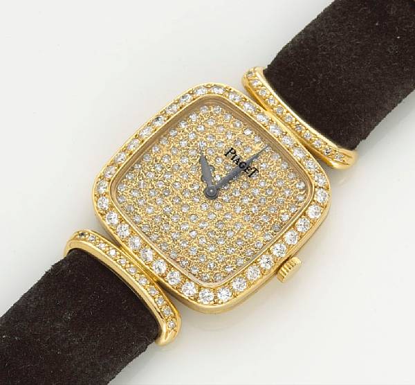 Appraisal: A lady's diamond wristwatch with black strap Piaget Swiss assay