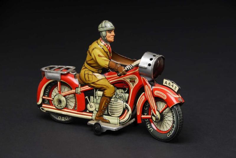 Appraisal: Tin Arnold Motorcycle Wind-Up Toy Description German Working Marked Made