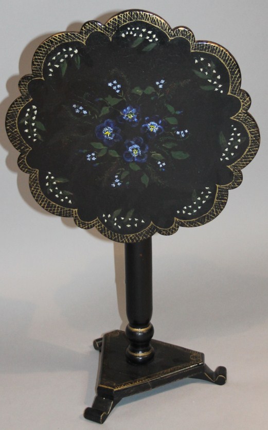 Appraisal: A thC ebonised oak occasional table the flower head top