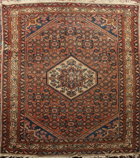 Appraisal: AN ANTIQUE PERSIAN HAMADAN RUG the central medallion on a