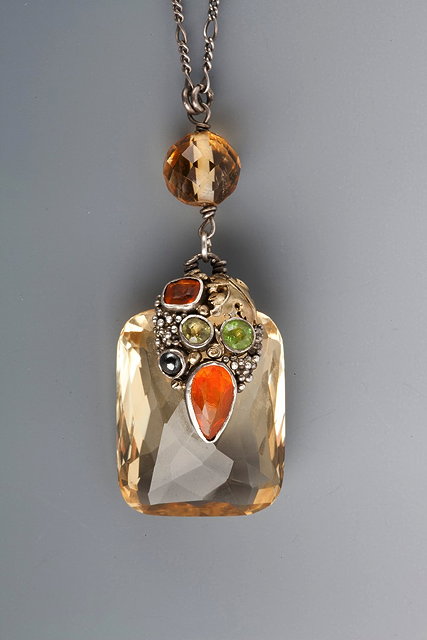 Appraisal: AN ARTS CRAFT PENDANT AND CHAIN facet cut citrine attached