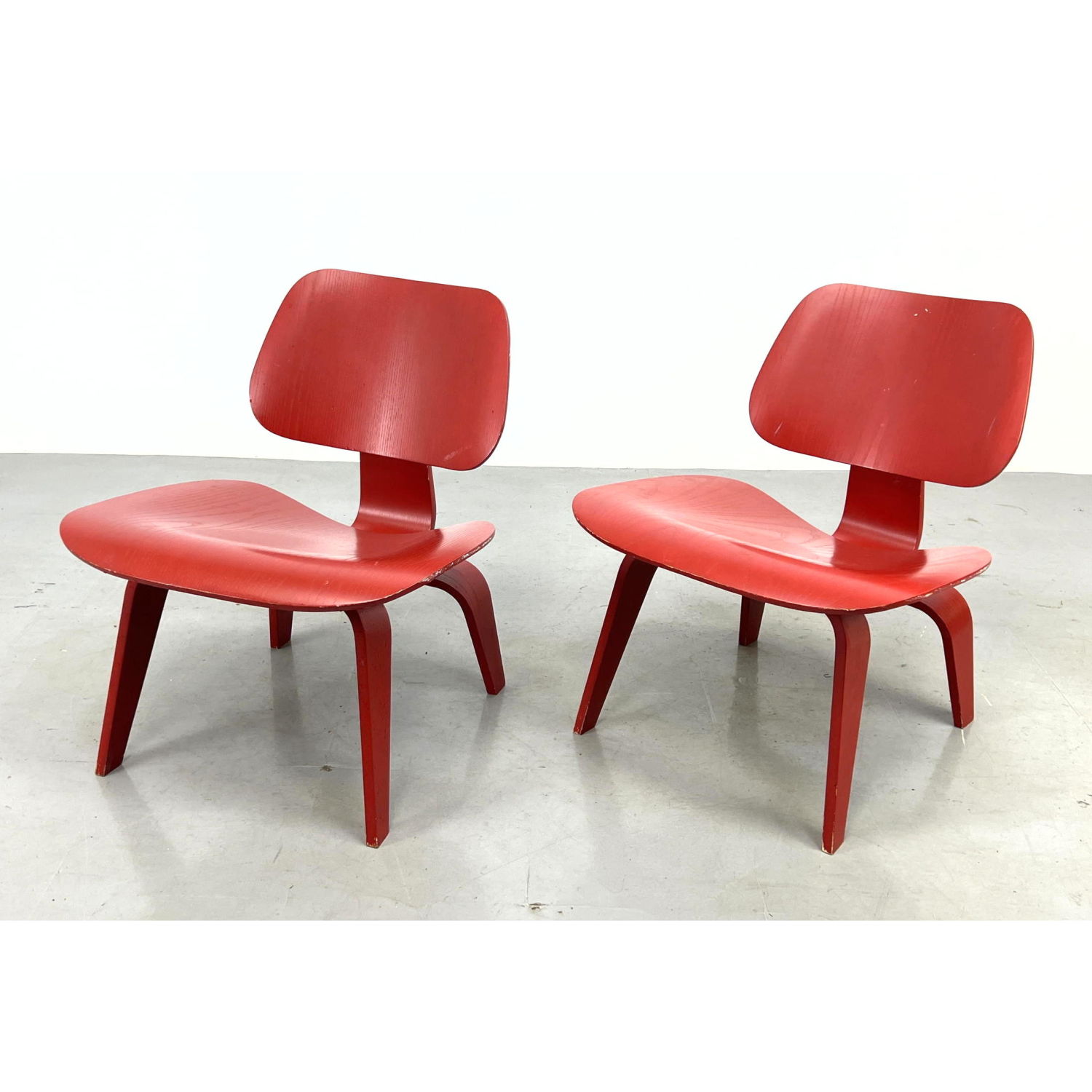 Appraisal: CHARLES EAMES for HERMAN MILLER Red LCW Chairs Wood Lounge