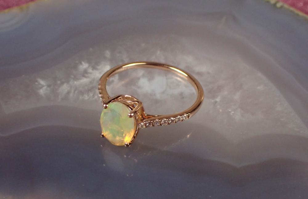 Appraisal: FIRE OPAL DIAMOND AND FOURTEEN KARAT GOLD RING The rose