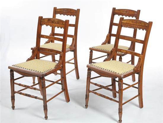 Appraisal: FOUR VICTORIAN SIDE CHAIRS Walnut ladderback chairs with sawtooth carved