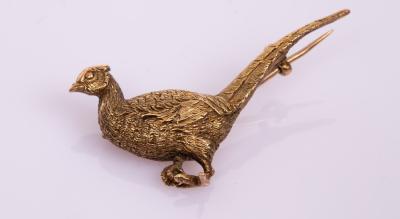 Appraisal: A late th Century ct yellow gold pheasant brooch approximately