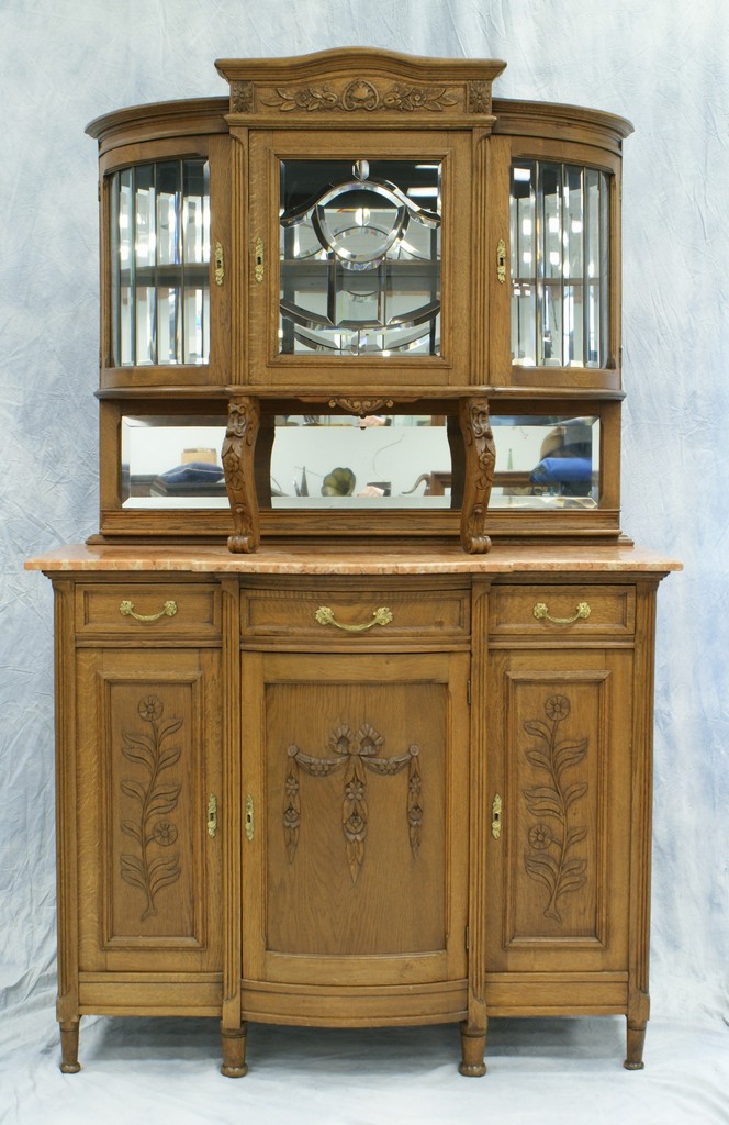 Appraisal: Carved oak French sideboard with pink marble top the top