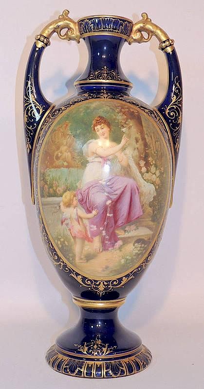 Appraisal: Royal Vienna Porcelain Urn With maiden and cupid-decorated panel Signed