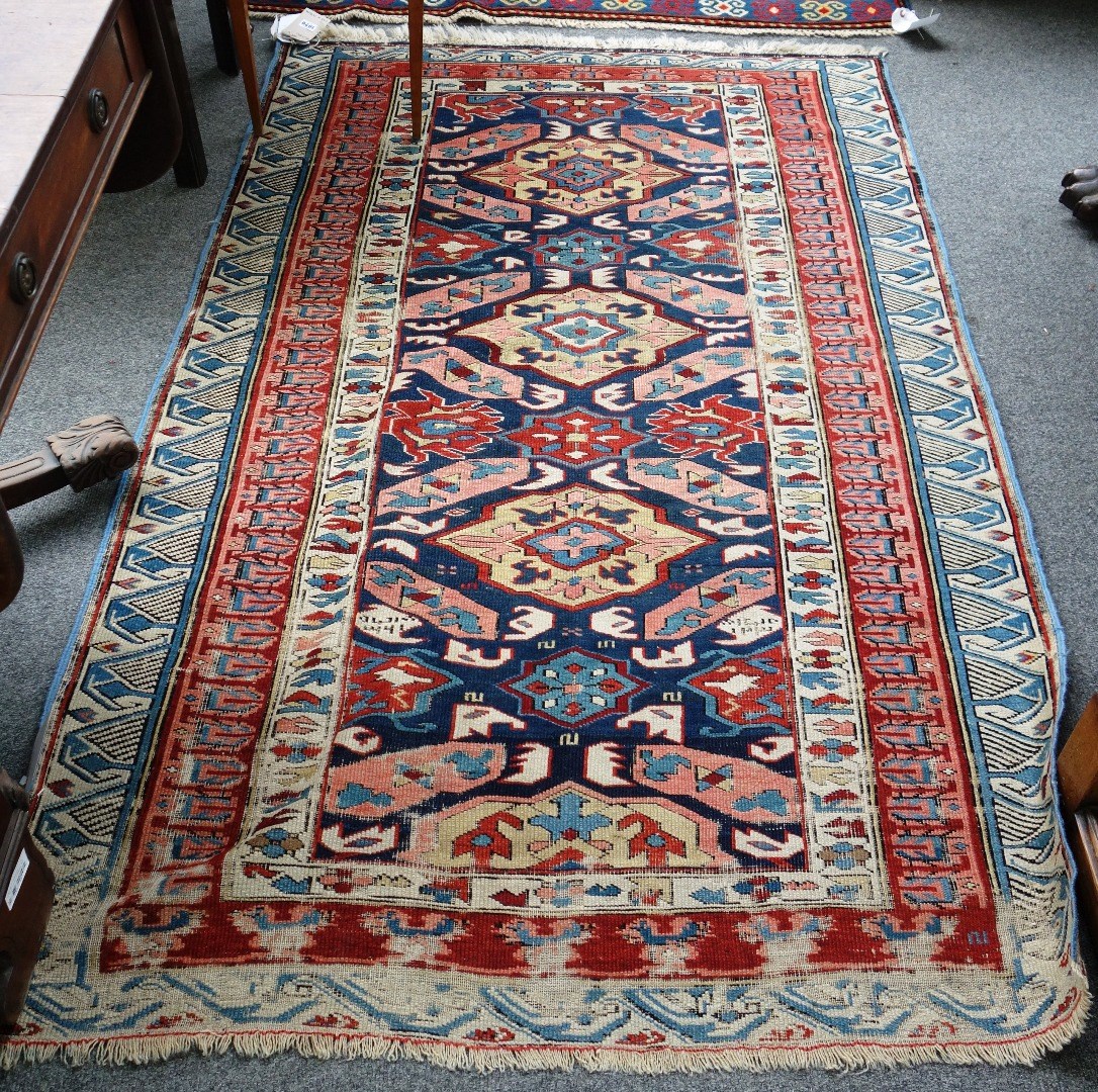 Appraisal: A Seychour rug Caucasian the indigo field with three and