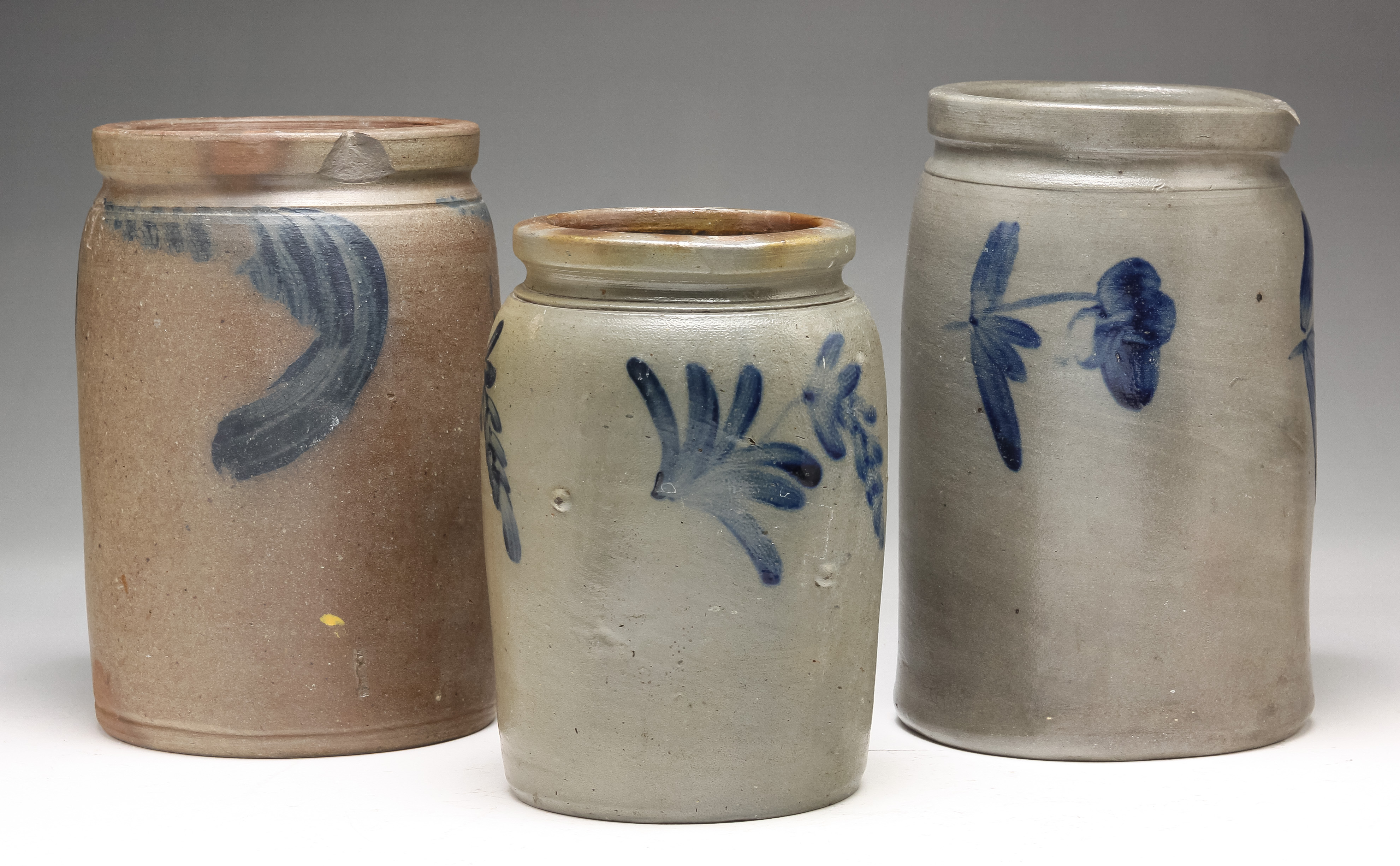 Appraisal: THREE AMERICAN STONEWARE CANNING JARS Mid th century Brushed cobalt