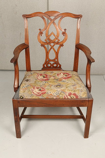 Appraisal: A GEORGE III MAHOGANY ARMCHAIR with scroll splat back needlework