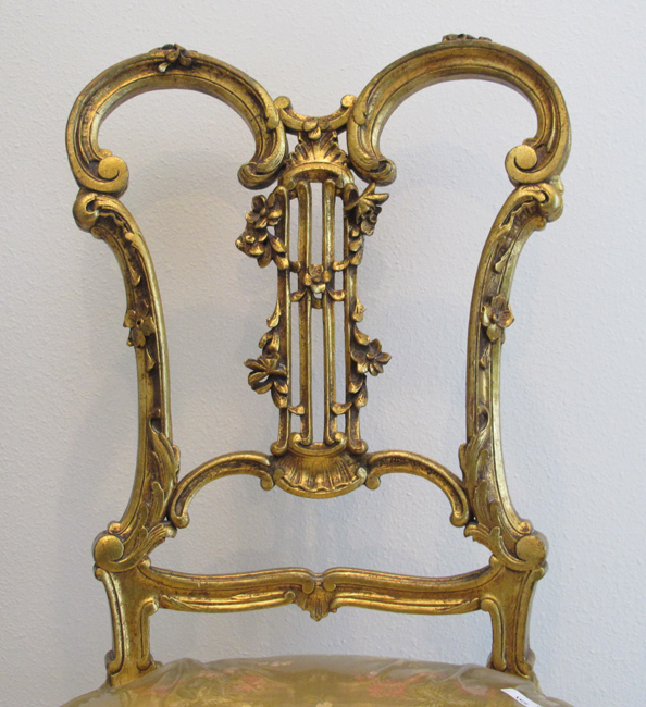 Appraisal: CONTINENTAL CARVED GILT WOOD ROCAILLE CHAIR Elegant carved back with