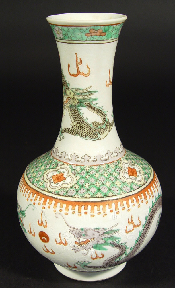 Appraisal: Oriental porcelain bottle vase enamelled with scaled dragons onto a