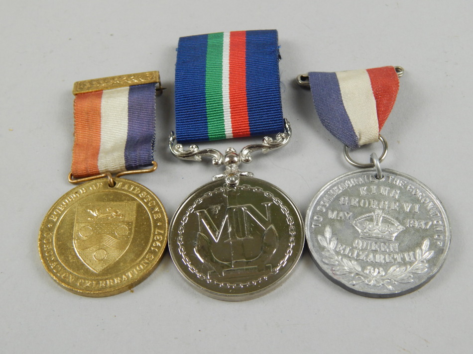 Appraisal: A Merchant Naval Service medal with blue green white and