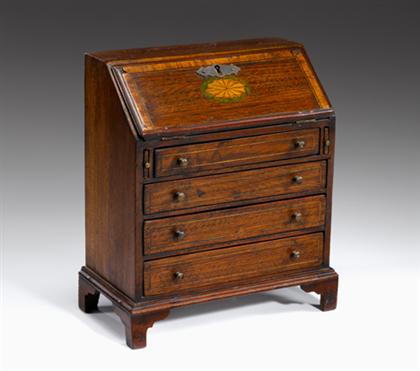 Appraisal: Miniature mahogany inlaid bureau mid th century The banded slant