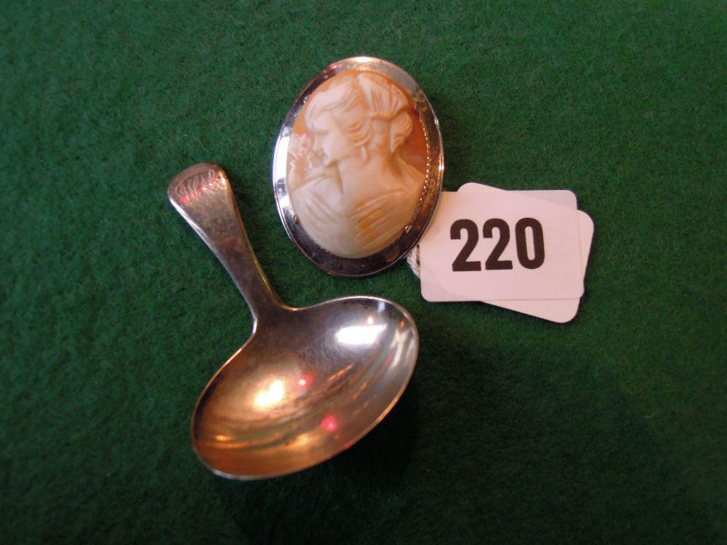 Appraisal: A Georgian silver caddy spoon and a silver framed cameo