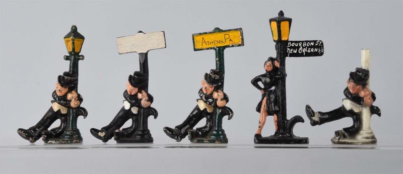 Appraisal: Cast Iron Figural Bottle Openers Three drunks by sign post