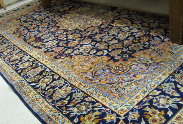 Appraisal: PERSIAN KASHAN CARPET floral and central floral medallion design on