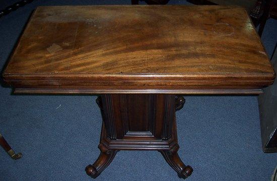 Appraisal: A th Century mahogany card table the rectangular swivel top