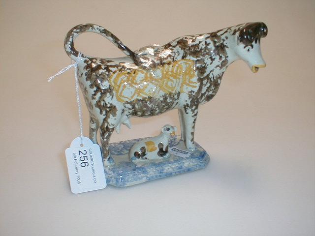 Appraisal: A Pearlware cow creamer possibly Yorkshire modelled standing four-square with