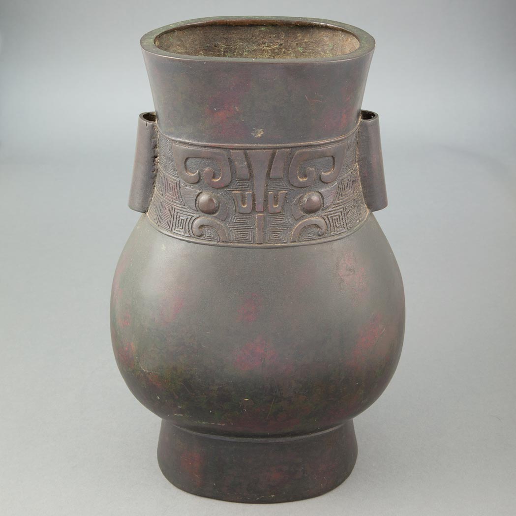 Appraisal: Chinese Bronze Vase th Century Of hu form raised on