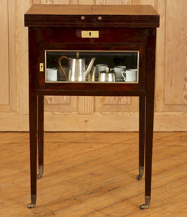 Appraisal: EDWARDIAN MAHOGANY POP-UP BAR CART An Edwardian mahogany pop-up bar