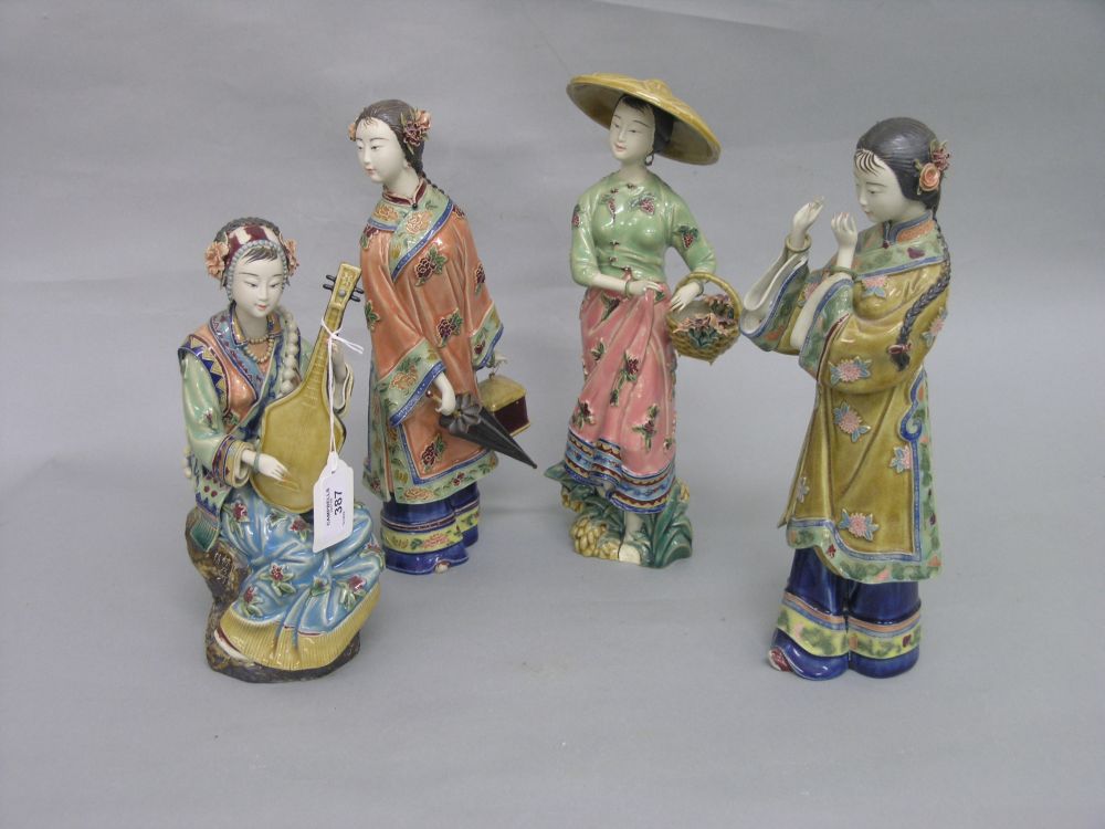 Appraisal: A group of four Chinese porcelain figures each a maiden