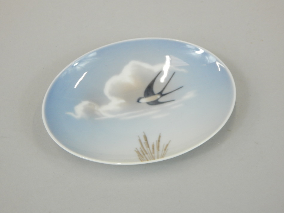 Appraisal: A Royal Copenhagen oval dish decorated with a swallow number