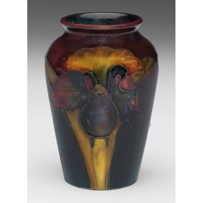 Appraisal: Moorcroft vase rich color orchid design on dark ground paper