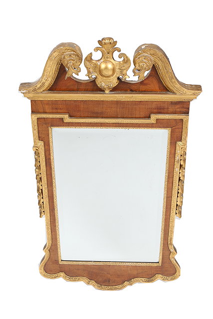 Appraisal: A GEORGE III WALNUT PARCEL GILT FRAMED WALL MIRROR with