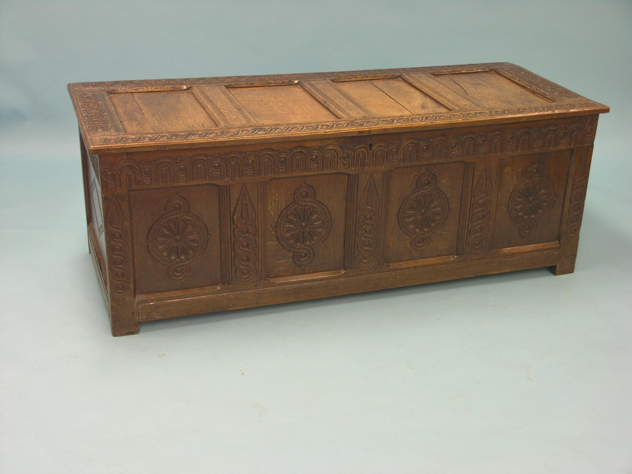 Appraisal: A large late th century oak coffer four-panelled construction with