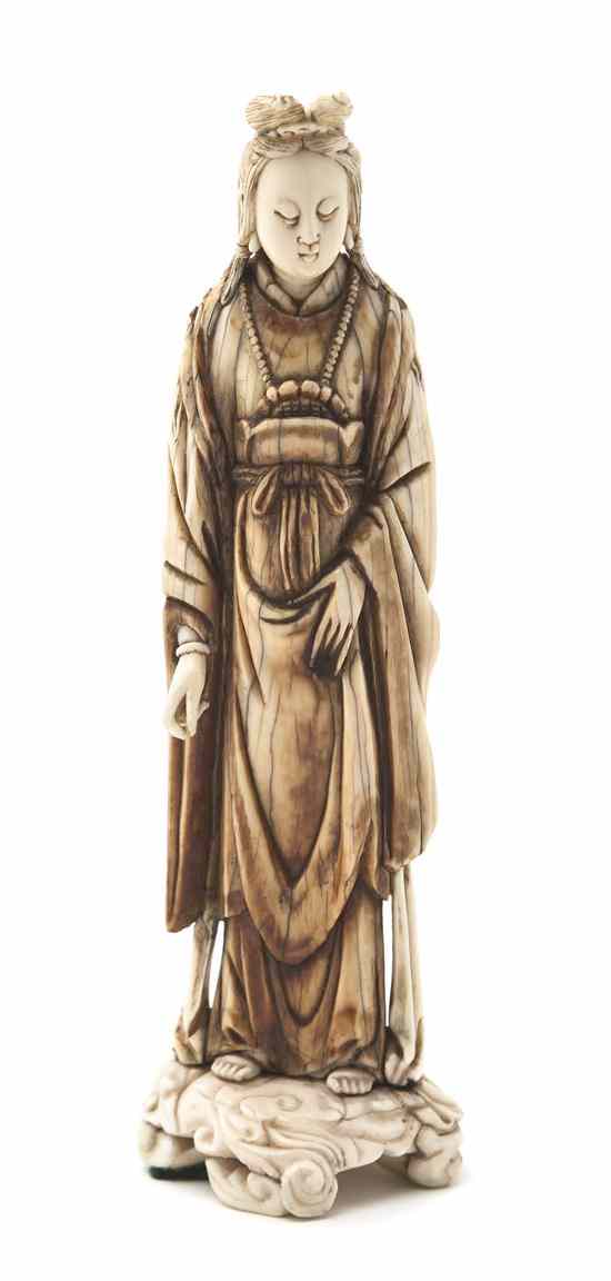 Appraisal: A Chinese Ivory Carving of a Lady depicting the robed