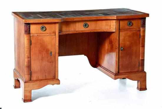 Appraisal: Regency style fruitwood kneehole desk early th century shaped rectangular