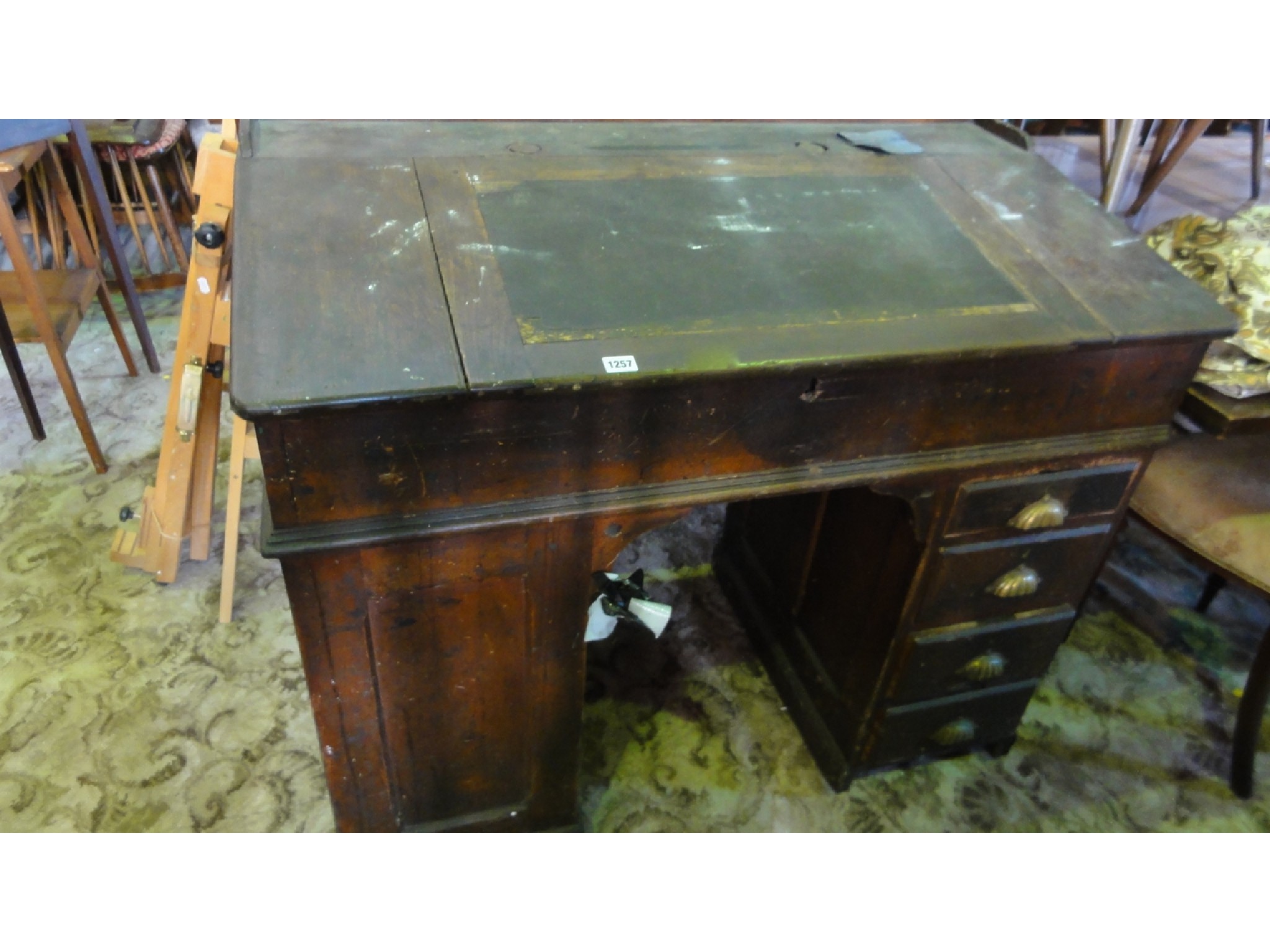 Appraisal: A Victorian oak kneehole and twin pedestal clerks desk with