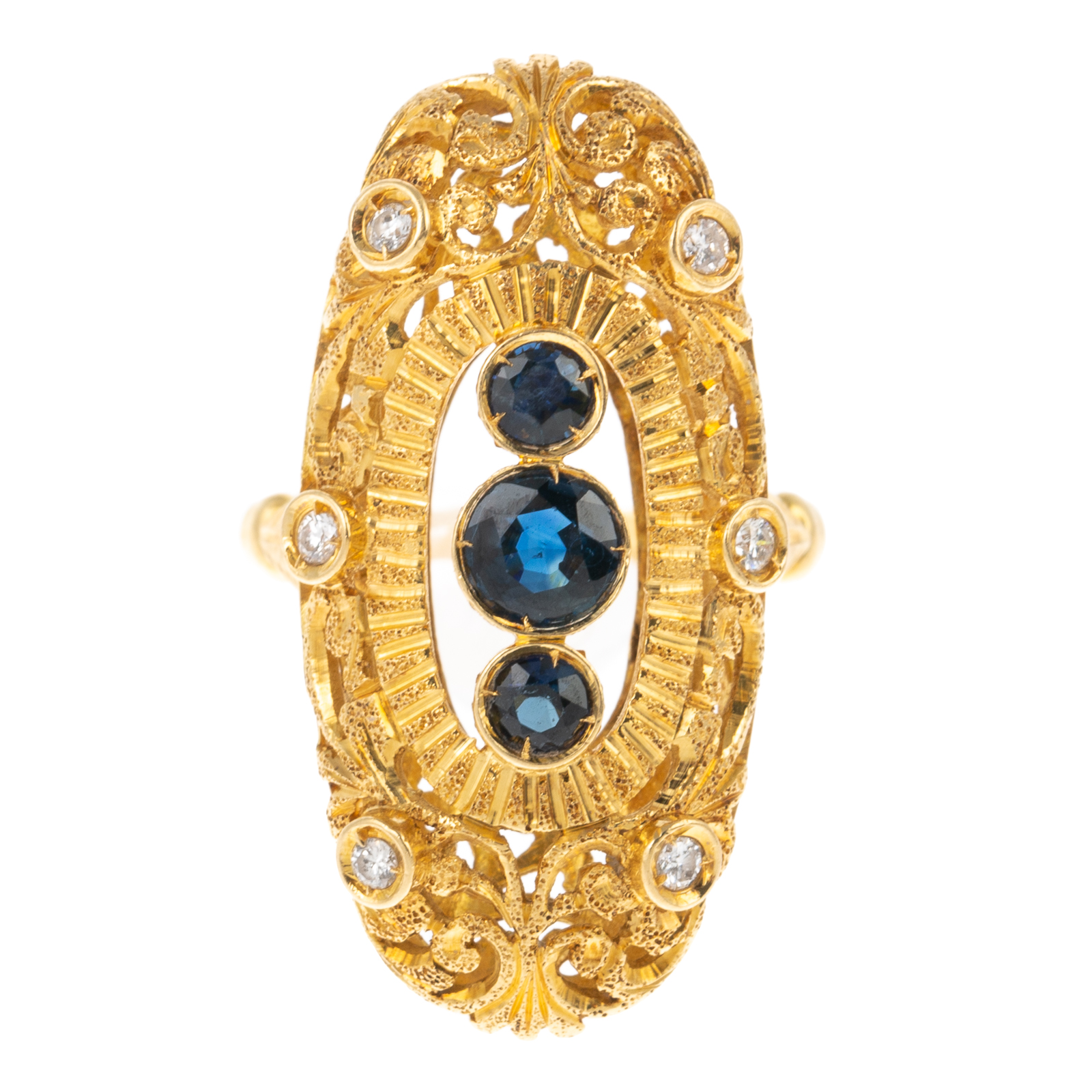 Appraisal: AN ELONGATED FILIGREE SAPPHIRE RING IN K K yellow gold