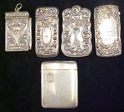 Appraisal: Four silver match safes all monogrammed along with a miniature