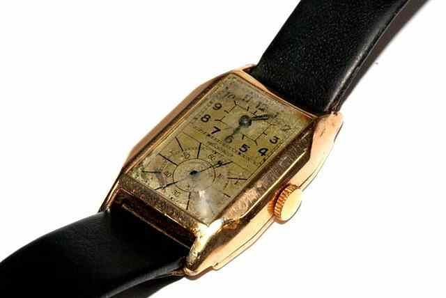 Appraisal: A GENTLEMANS CT DOUBLED FACED WRIST WATCH rectangular face with