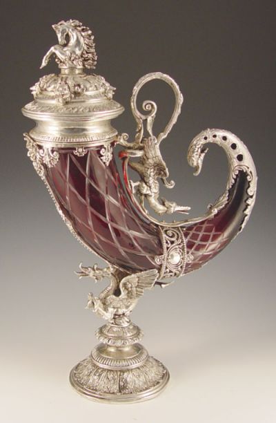 Appraisal: DECORATIVE SILVER RUBY GLASS CORNUCOPIA URN Cut to clear ruby