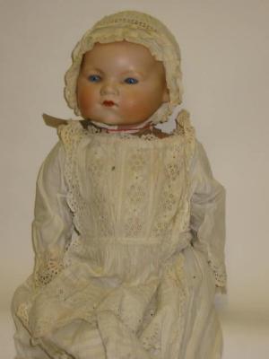 Appraisal: An Armand Marseille bisque head baby doll with blue glass