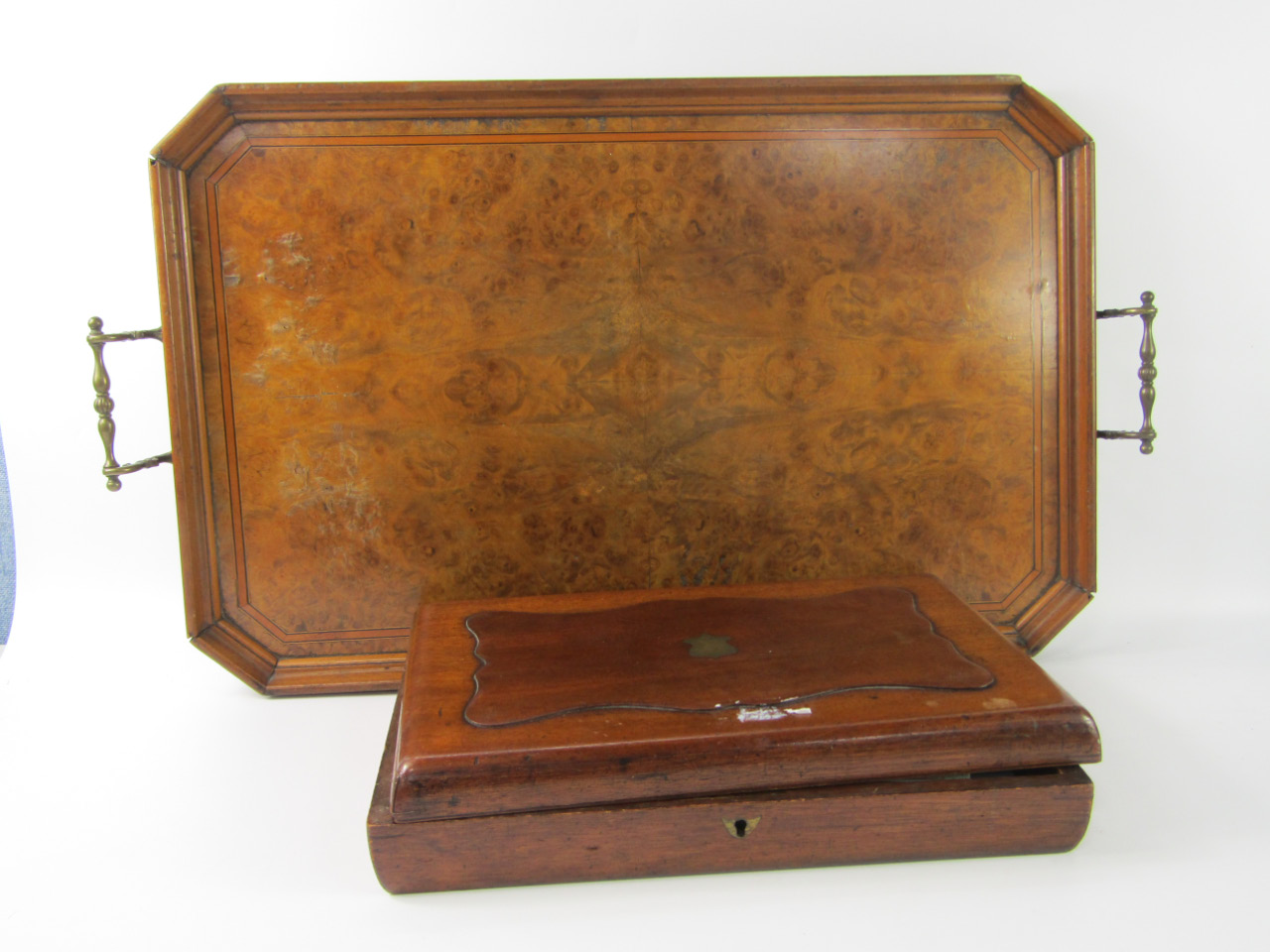 Appraisal: An Edwardian burr walnut and satinwood inlaid twin handled galleried