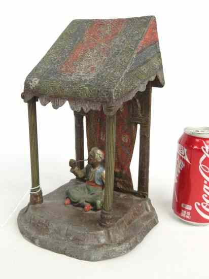 Appraisal: C signed Austrian pot metal painted lamp Arab man smoking