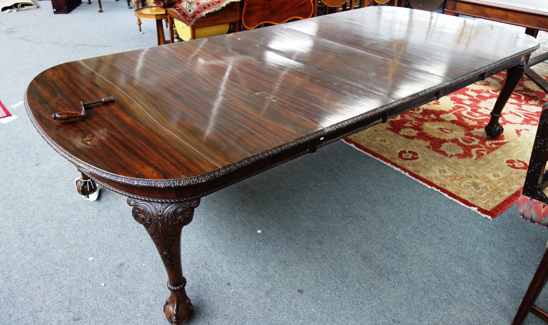 Appraisal: An early th century mahogany extending dining table the rounded