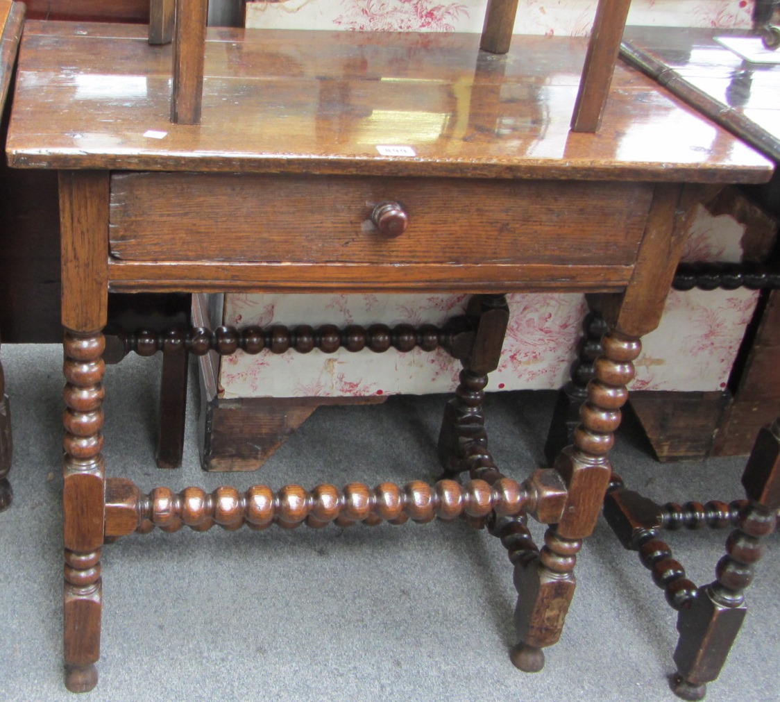 Appraisal: A Charles II oak side table with single drawer on