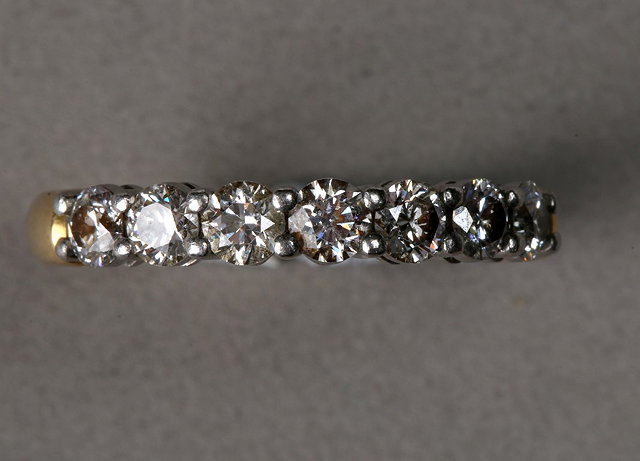 Appraisal: A DIAMOND SET HALF ETERNITY RING seven claw set brilliant